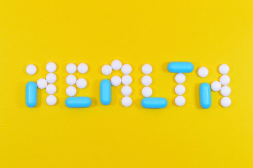 Pills arranged to spell health