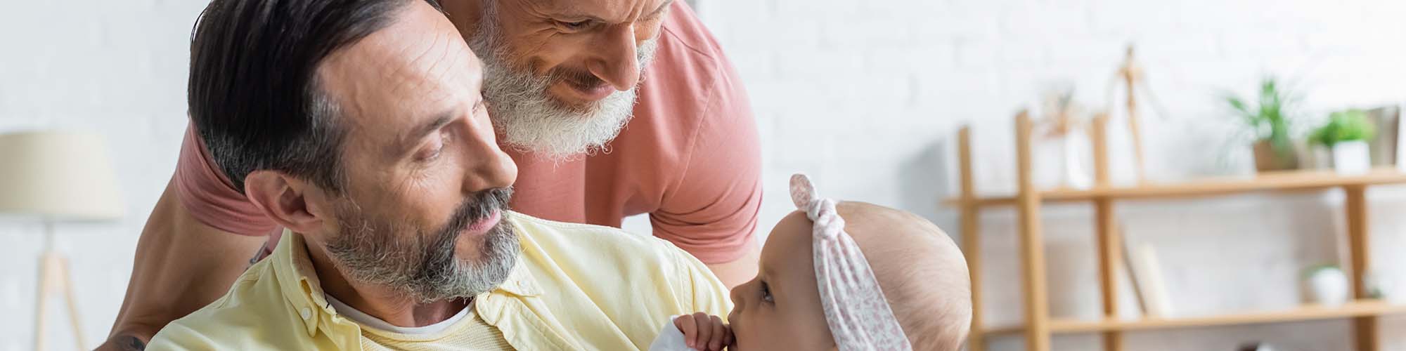 Two men with baby