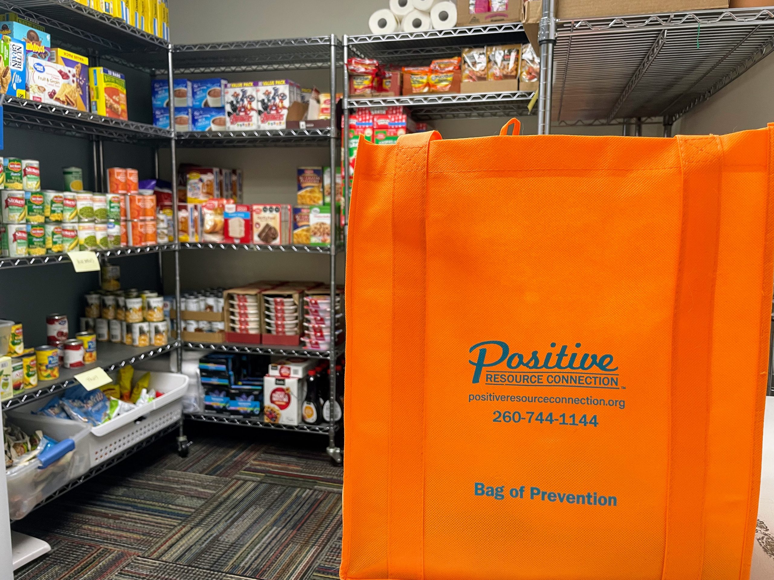 Orange Bag of Prevention with pantry in background