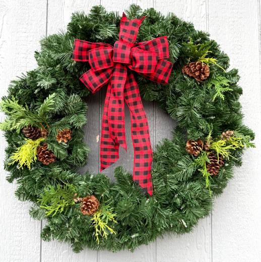 Fresh green wreath with red and black plaid bow