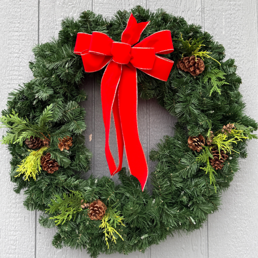 Fresh green wreath with red and gold bow