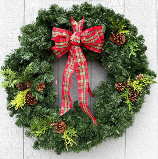 Fresh green wreath with red and green plaid bow